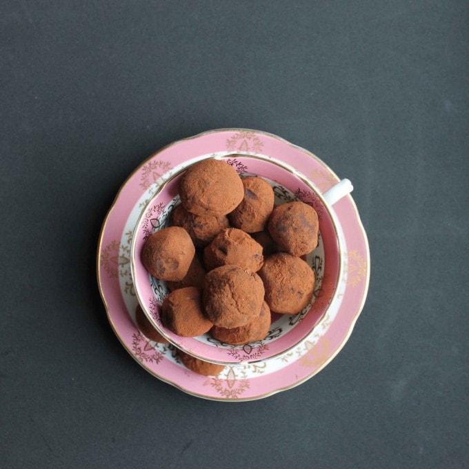 Beetroot Chocolate and Smokey Lapsang Souchong Tea Truffles recipe in a pink vintage teacup on black background