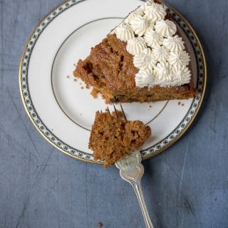 A slice of fluffy and moist easy carrot cake. This nut-free recipe is lighter with yogurt instead of half the oil.