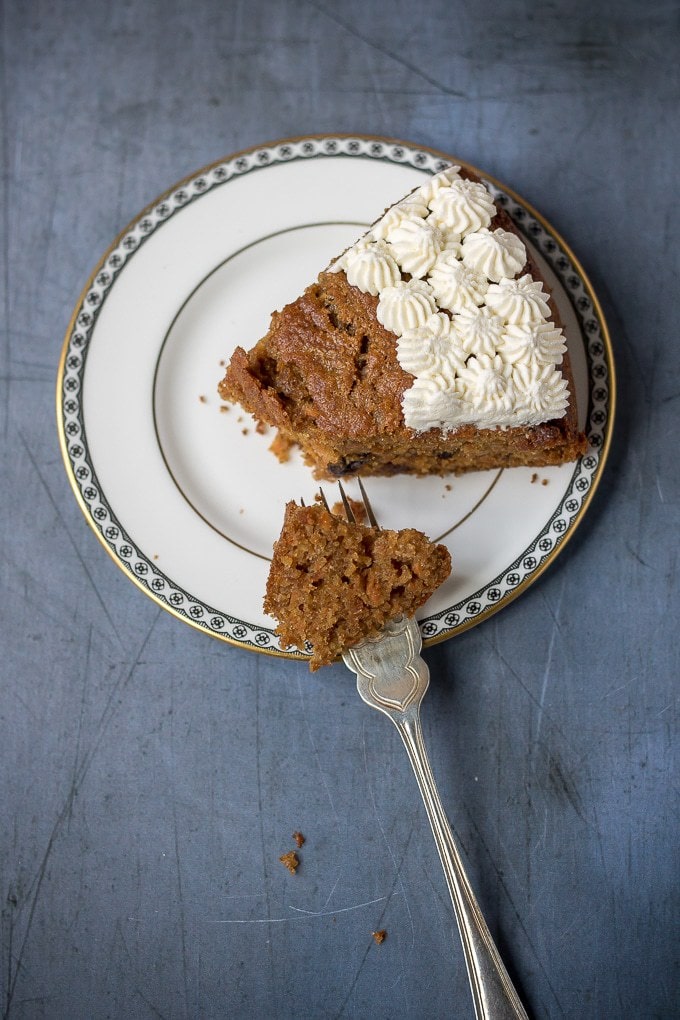 A slice of fluffy and moist easy carrot cake. This nut-free recipe is lighter with yogurt instead of half the oil. 