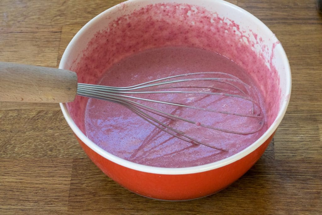 How to make beet pancakes: Step 2 - Add the milk and vanilla and mix into a batter