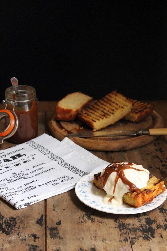 A slice of grilled cake topped with ice cream and caramel.