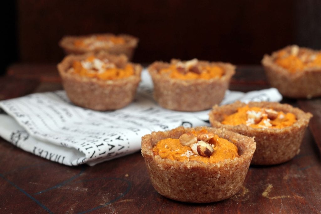 Pumpkin Tarts with Chai Hazelnut Crust on a white napkin