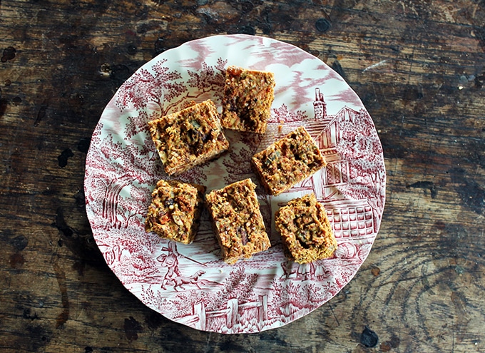 Superfood Cake Bars on a vintage plate on a wooden table.