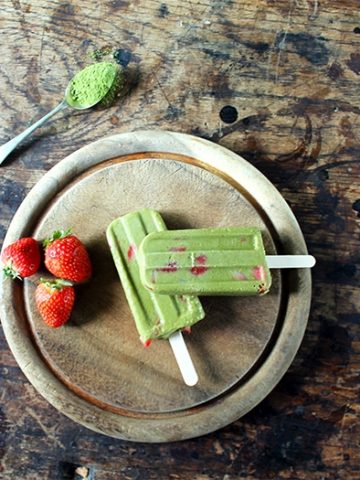 Popsicles on a wooden board.