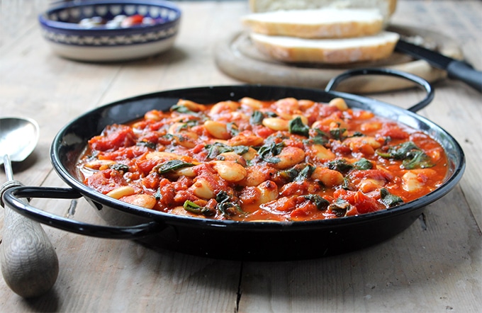 A large bowl of beans in tomato sauce.