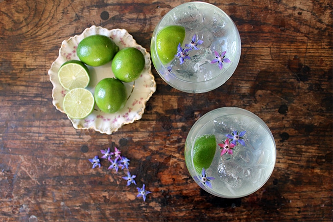 Glasses of cocktail on a wooden table.