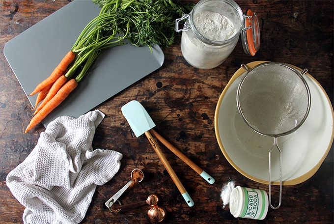 Ingredients laid out on wooden table for Cinnamon Carrot Soda Bread recipe