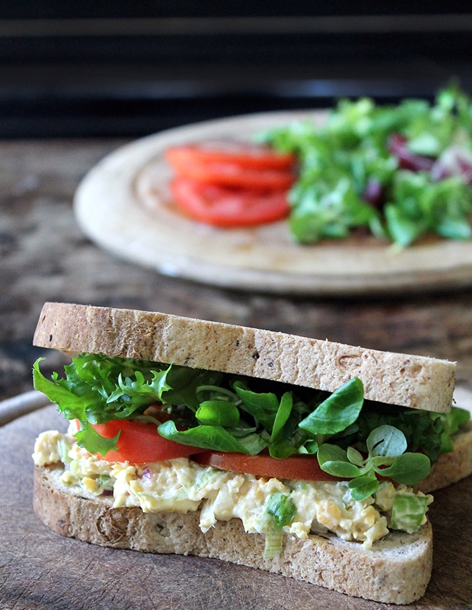 A close up of a sandwich made from chickpeas.