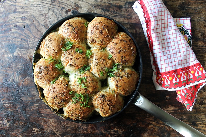 A skillet (use a frying pan or casserole dish) of fluffy fresh garlic and herb cheesy bread rolls. Get the recipe for these tasty dinner rolls now. 