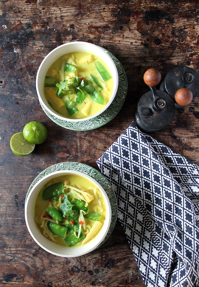 Bowls of soup on a wooden table.