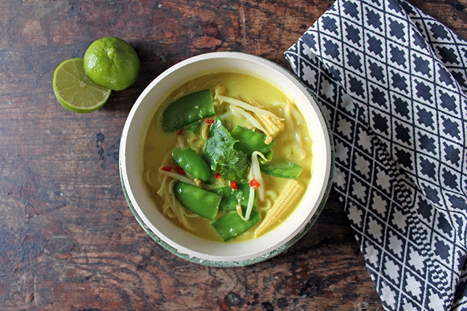 A bowl of soup sitting on a table.