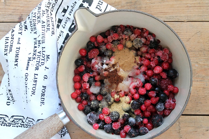 Pot of berries with sugar.