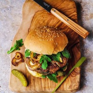 Burger on a wooden board.