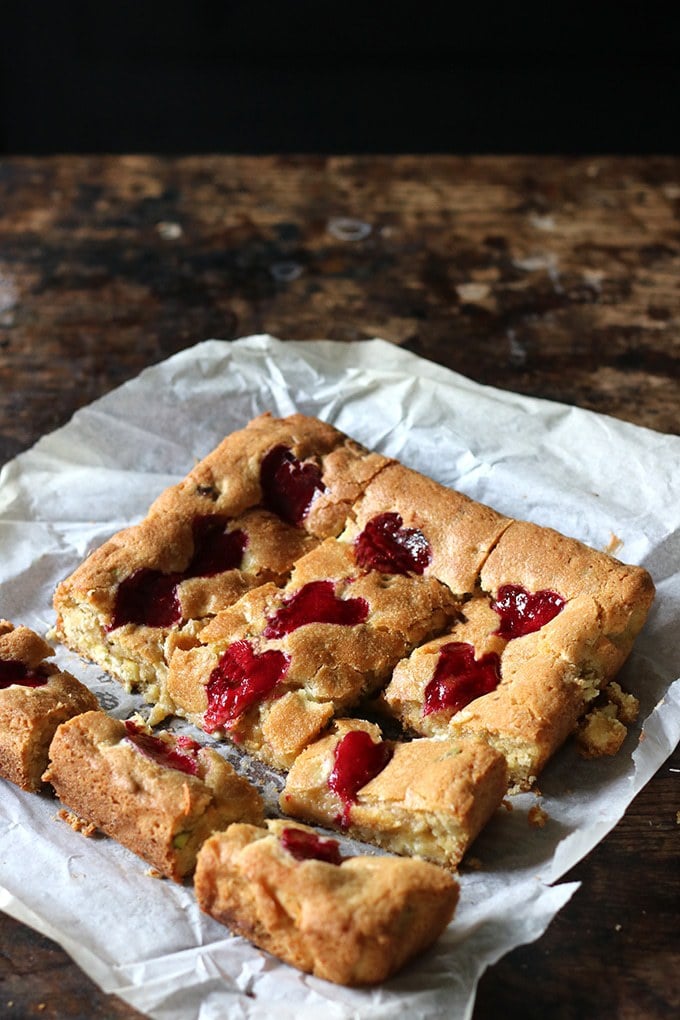 A tray of blondies being cut into squares.