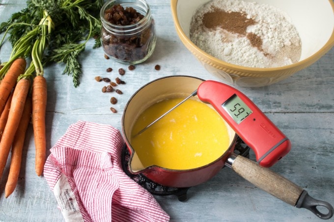 Making Carrot and Ginger Hot Cross Buns - ingredients laid out and a cooking Thermometer testing the heat.