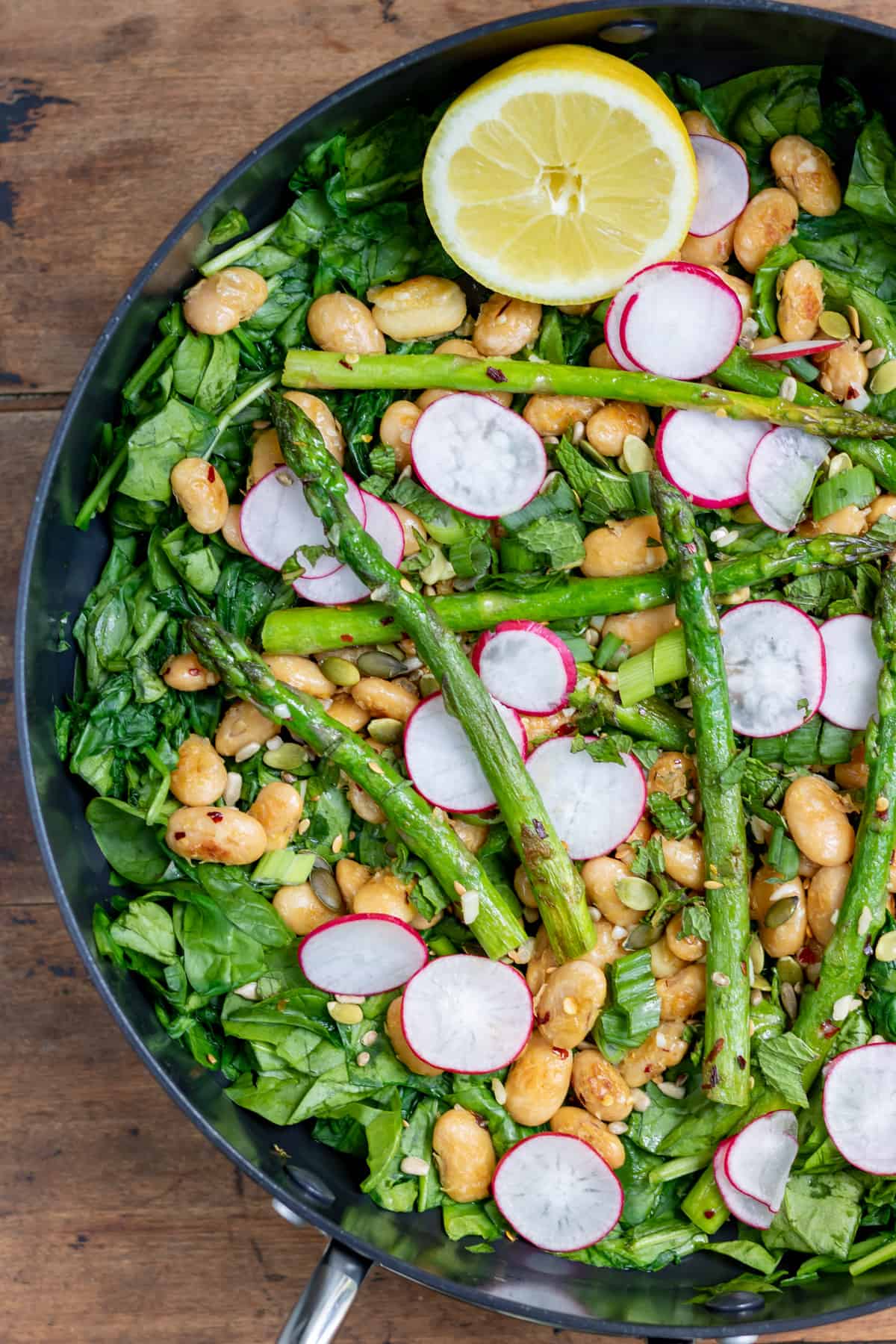 Close up of warm salad in a pan.