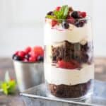 A glass of cookie cheesecake parfait.