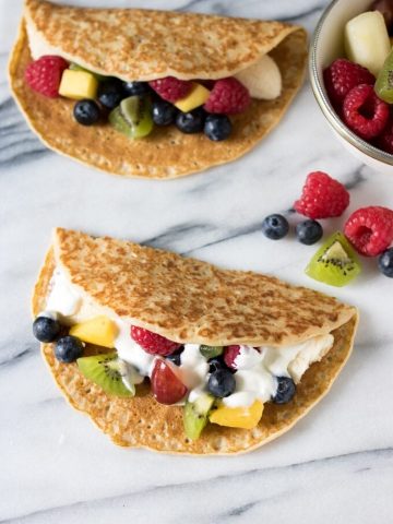 Crepes stuffed with yogurt and fruit to look like tacos.