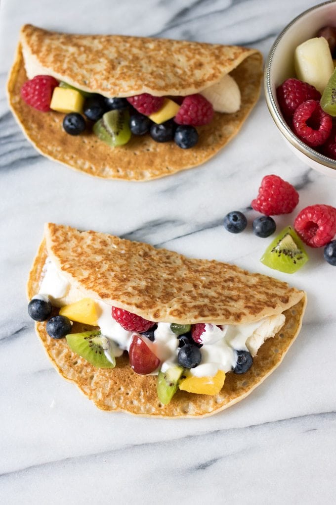 Crepes stuffed with yogurt and fruit to look like tacos.