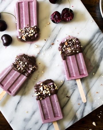 Popsicles on a marble board.