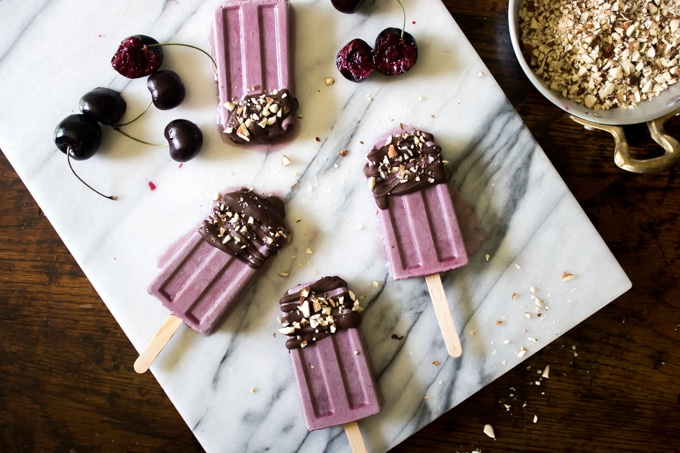 Popsicles on a marble board.
