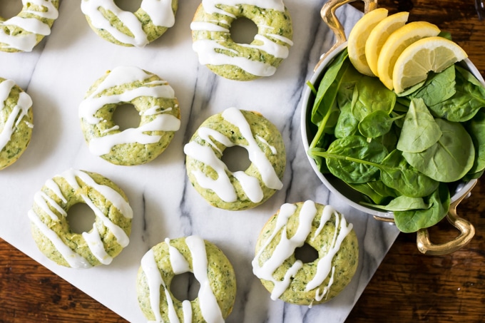 Spinach donuts on a marble board.