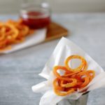 Spiralized fries in a pot.