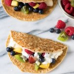 Fruit tacos on a marble board.