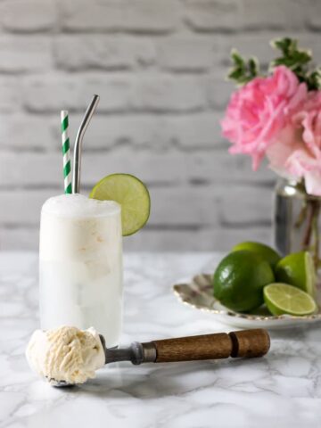 Ice cream lumber with the waft with a scoop of ice cream in front and a vase of plants.  Apple Parsnip Cupcakes with Boozy Apple Ci GT Float 2 360x480