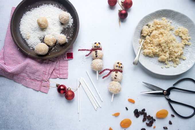 Easy no-bake vegan almond coconut bliss balls are threaded onto sticks to make fun Christmas snowmen. A fun festive healthy treat for kids. 
