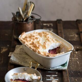 Serving dish and plateful of pudding.