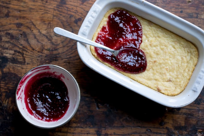 Spreading jam on baked custard. 