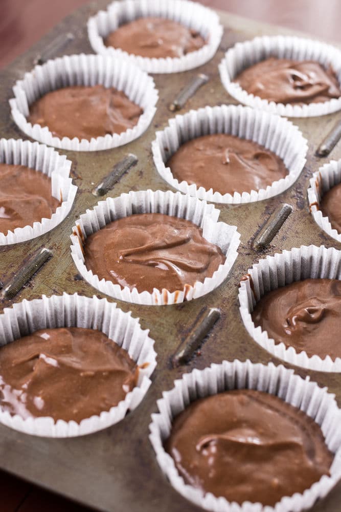 How to make vegan chocolate cupcakes recipe - spoon batter into paper cases
