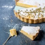Lemon tart with chamomile tea pastry crust and a dusting of chamomile-infused powdered sugar