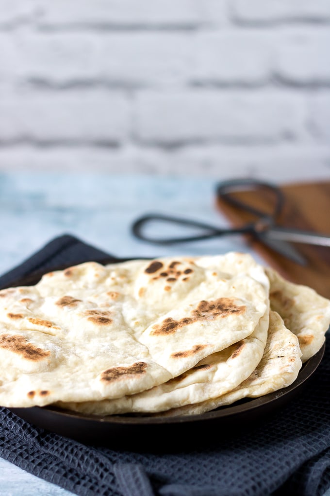 A stack of light and fluffy, quick and easy naan bread - yeast free.