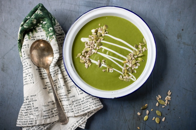 Bowl of soup drizzled with cream.