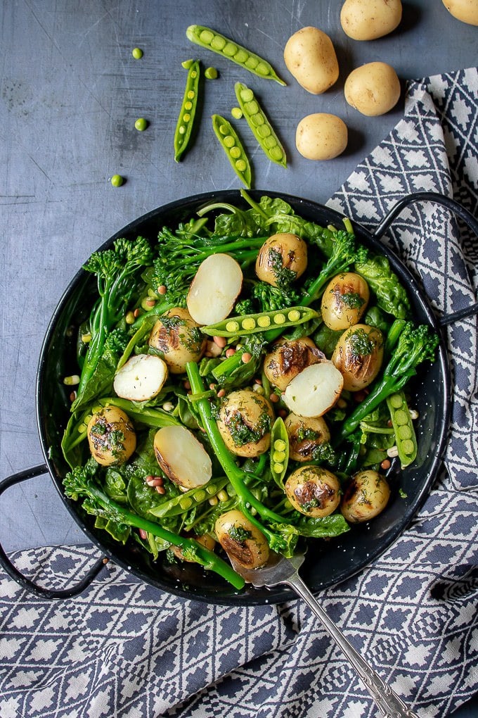 Bowl of broccoli salad on a table.