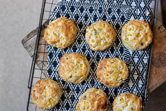 Overhead photo of sweetcorn jalapeno goat's cheese scones cooling on a vintage rack