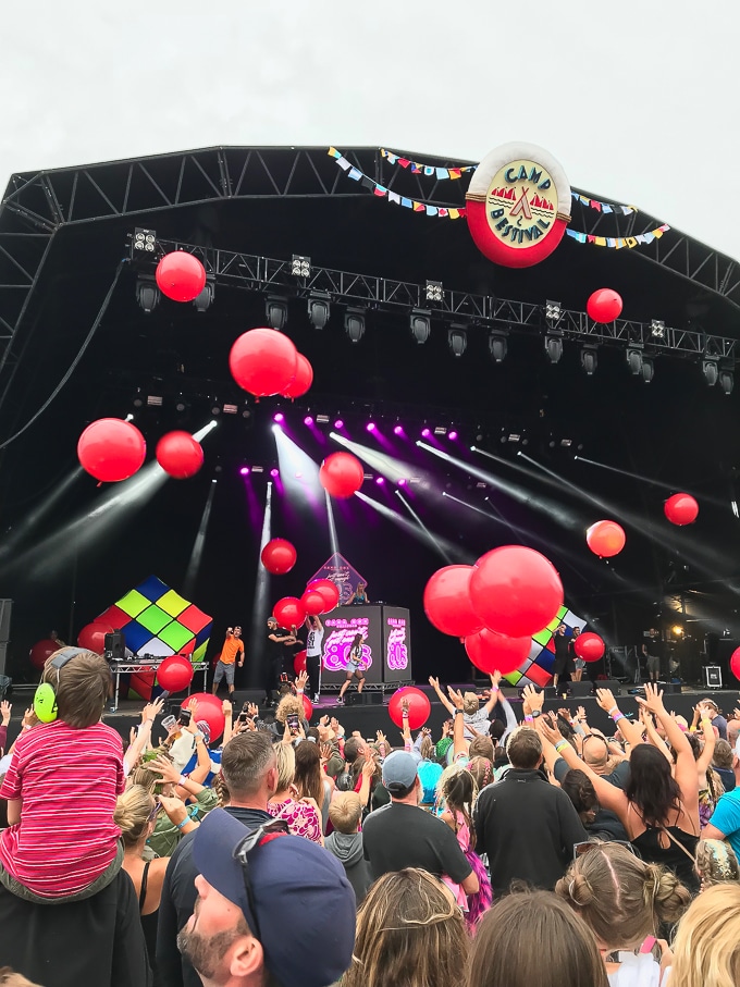 Giant red balloons being released over the crowd during Sarah Cox's 80s DJ set at Camp Bestival 2018