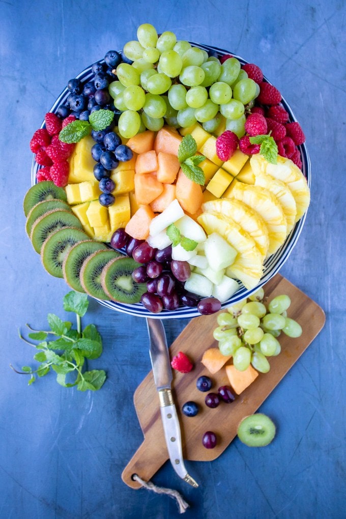 Fruit platter served on a cake stand.
