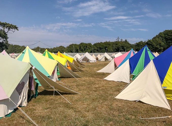 Rows of colourful bell tents - Boutique Camping / glamping. Bellepad Podpads Review