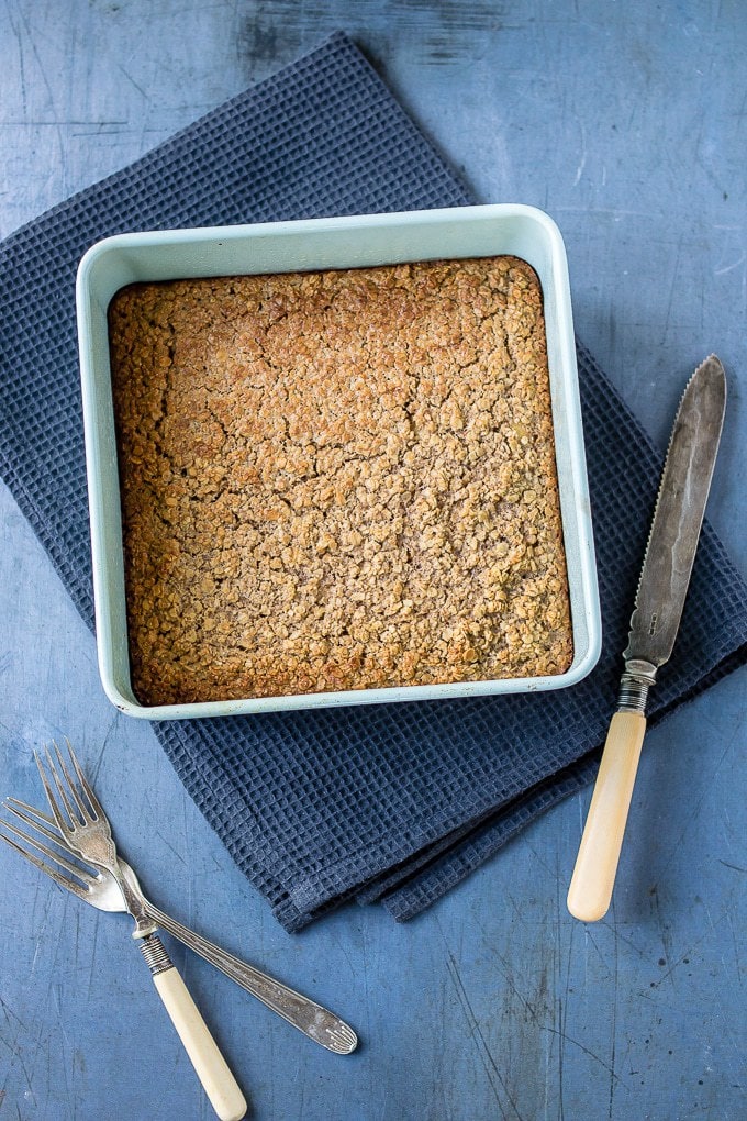 A square baking pan of cooked oatmeal.