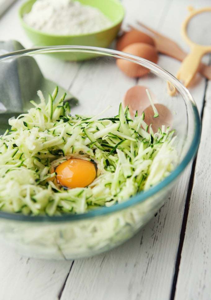 Bowl with grated courgette and eggs.