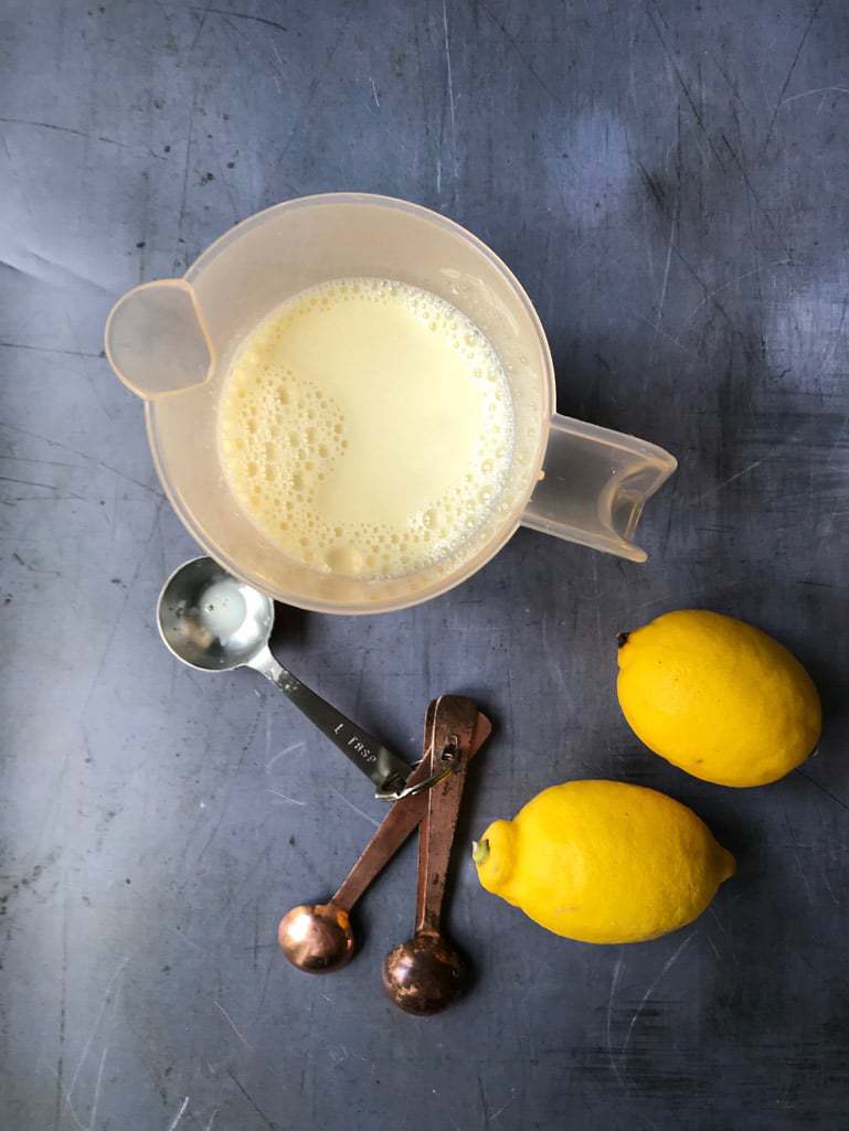 lemons and measuring jug of milk