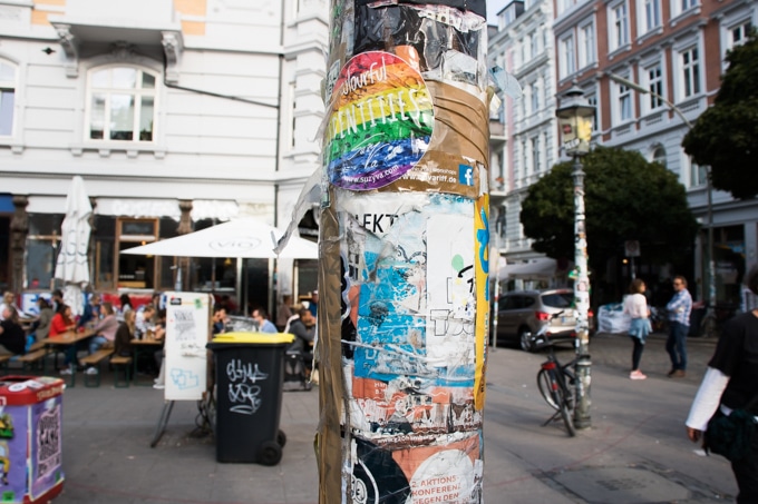 Street in Sternschanze, St Pauli Hamburg, with stickers on a lamppost