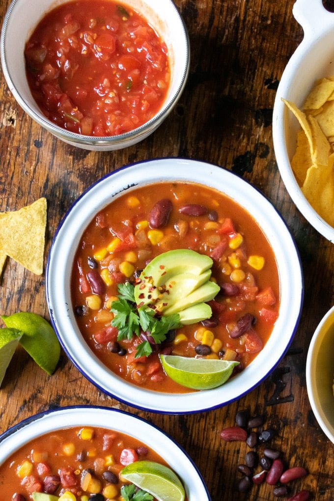 Bowl of bean soup on a table.