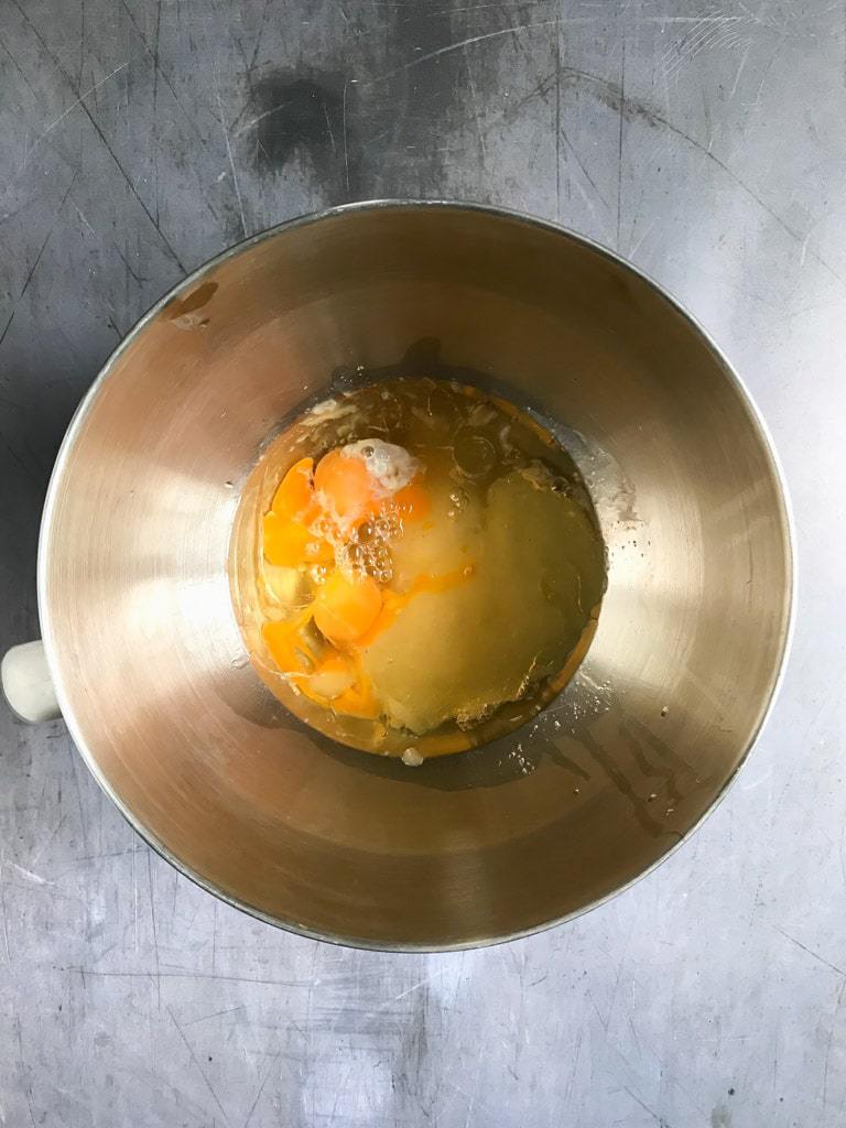 Beating the eggs, oil, vanilla, applesauce and sugar together.