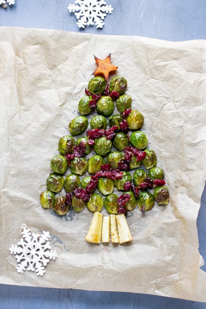 Roasted brussels sprouts in a Christmas tree shape, with parsnip base, cranberry decorations and squash star