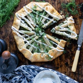 Galette made of pastry and vegetables on a table.