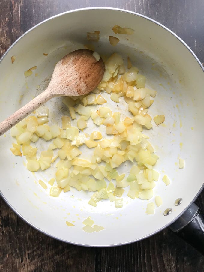 Cooking onions in a pan.